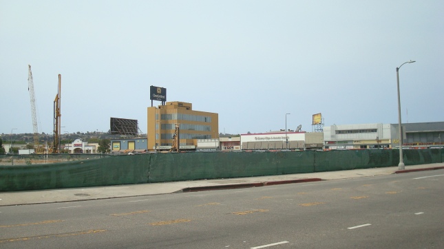 The fence surrounds a large empty parcel just across the street from the MTA site.