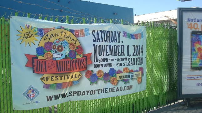 Banner advertising a Dia de los Muertos celebration on Harbor Boulevard.