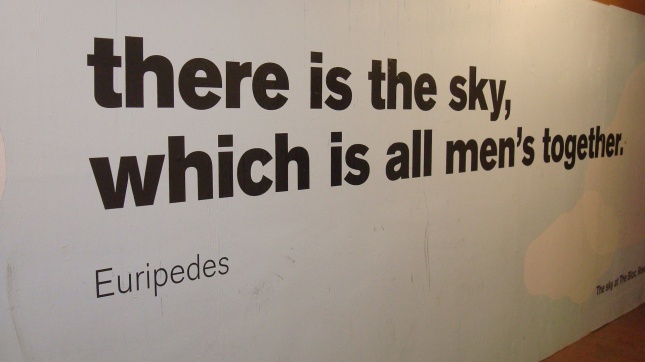 Construction barrier with a quote from Euripides.