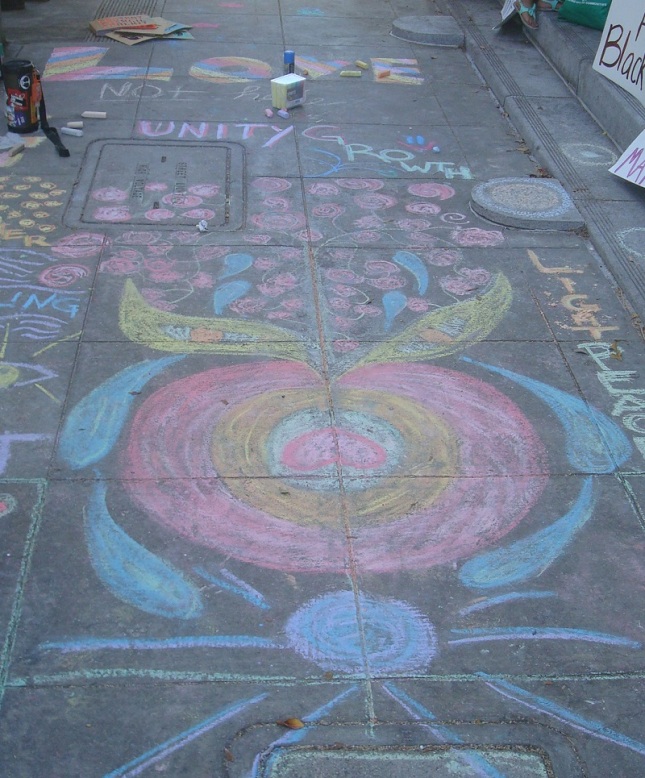 Chalk drawings on the sidewalk in front of City Hall.